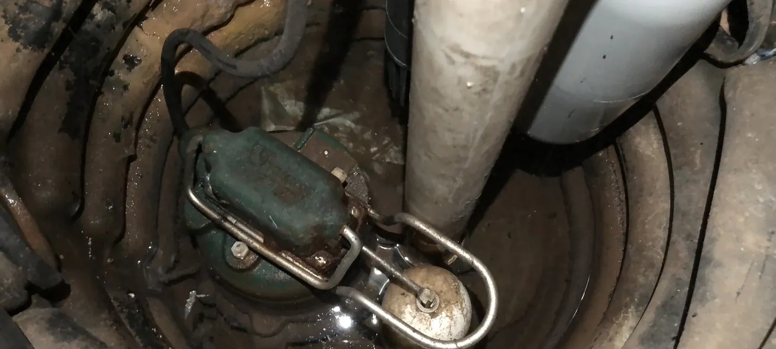 Sump pump sitting in a basement sump pit